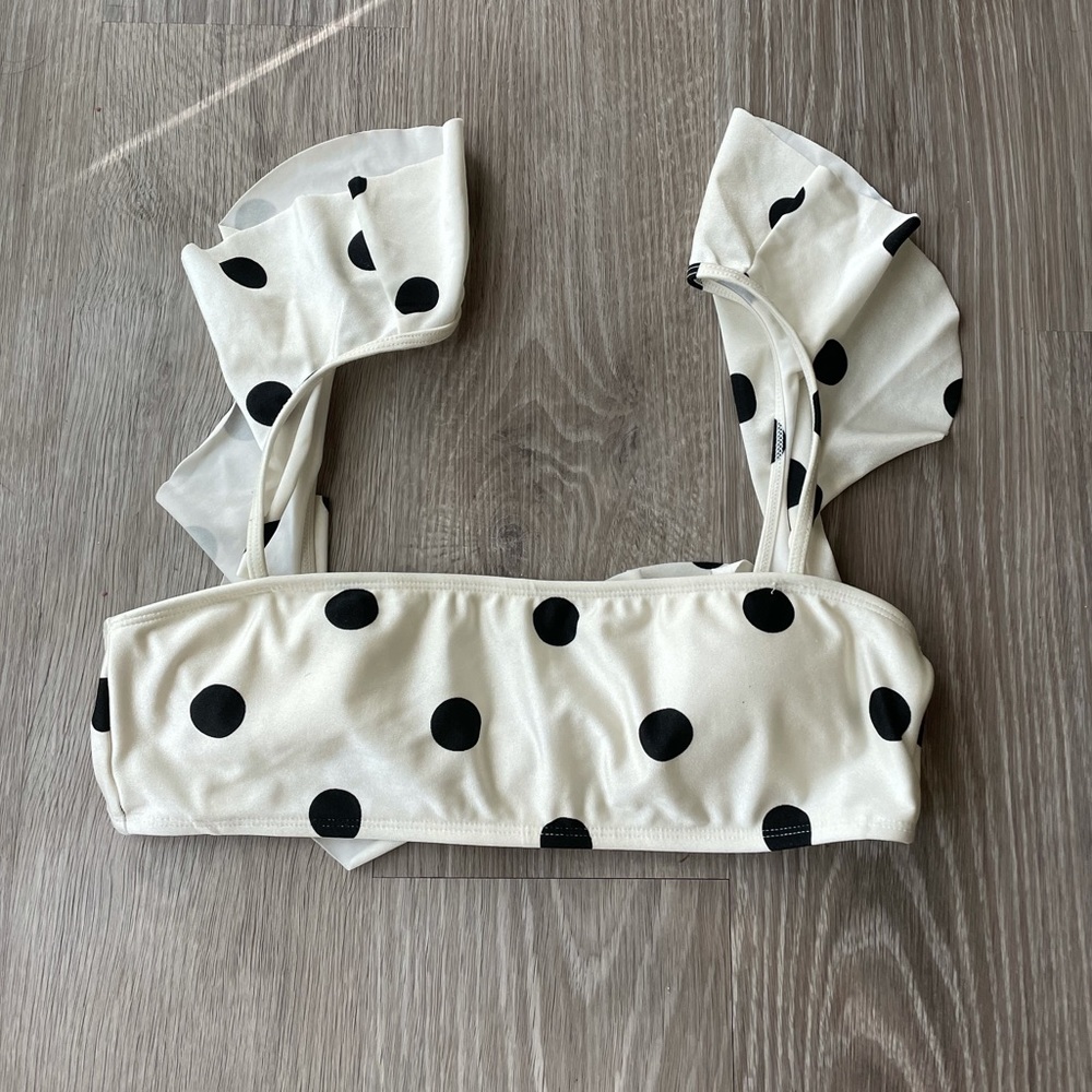White polka dot bikini top with ruffle sleeves